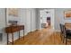 Hallway with hardwood floors, modern console table, and doorway leading into living room at 2817 Lincoln Dr, Decatur, GA 30033