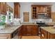 Kitchen featuring granite counters, stainless appliances, and warm wood cabinetry and flooring at 2817 Lincoln Dr, Decatur, GA 30033