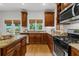 Bright kitchen featuring granite counters, stainless steel appliances, and views of the backyard at 2817 Lincoln Dr, Decatur, GA 30033