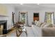 Cozy living room featuring a fireplace, neutral color palette, stylish furniture, and natural light at 2817 Lincoln Dr, Decatur, GA 30033