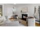 Living room featuring a cozy fireplace, stylish decor, and comfortable seating perfect for relaxation at 2817 Lincoln Dr, Decatur, GA 30033