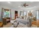 Spacious living room with hardwood floors, a stylish ceiling fan, and ample natural light at 2817 Lincoln Dr, Decatur, GA 30033