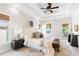 Spacious main bedroom with tray ceiling, windows, deck access, and stylish decor at 2817 Lincoln Dr, Decatur, GA 30033