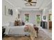 Spacious main bedroom with tray ceiling, windows, deck access, and stylish decor at 2817 Lincoln Dr, Decatur, GA 30033