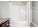 Bathroom featuring a shower-tub combo and vanity with granite countertops at 3271 Pennington Dr, Stonecrest, GA 30038