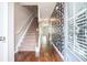 Inviting home entrance with staircase, hardwood floors, and stylish accent wall at 3271 Pennington Dr, Stonecrest, GA 30038