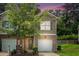 Charming townhome with brick accents, attached garage and inviting front yard at 3271 Pennington Dr, Stonecrest, GA 30038