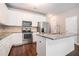 Modern kitchen with stainless steel appliances, granite countertops and ample cabinet space at 3271 Pennington Dr, Stonecrest, GA 30038