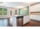 Kitchen island with granite countertops, stainless steel appliances and ample cabinet space at 3271 Pennington Dr, Stonecrest, GA 30038