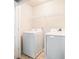Laundry room featuring white washer and dryer and wire shelving at 3271 Pennington Dr, Stonecrest, GA 30038
