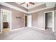 Carpeted main bedroom features a walk-in closet and ensuite bathroom at 3271 Pennington Dr, Stonecrest, GA 30038