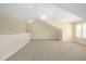 An expansive bonus room is bathed in natural light, offering ample space and featuring plush carpeting at 328 Brookhaven Walk, Johns Creek, GA 30097