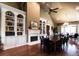 Formal dining area with custom bookshelves, fireplace, hardwood floors, and seating for eight at 328 Brookhaven Walk, Johns Creek, GA 30097