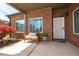 Inviting front porch with brick siding and a cozy bench at 328 Brookhaven Walk, Johns Creek, GA 30097