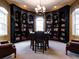 Charming library featuring custom built-in bookshelves, elegant lighting, and comfortable seating at 328 Brookhaven Walk, Johns Creek, GA 30097