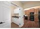 Convenient pantry area off the main kitchen with white cabinets, a sink, and added counter space at 328 Brookhaven Walk, Johns Creek, GA 30097