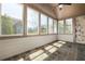 Sunroom with tile floors, a vaulted ceiling, and many windows, offering plenty of natural light at 328 Brookhaven Walk, Johns Creek, GA 30097