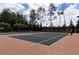 Outdoor tennis courts for residents, surrounded by lush trees, providing a scenic and active lifestyle at 328 Brookhaven Walk, Johns Creek, GA 30097