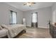 Comfortable bedroom features natural light, ceiling fan, and stylish wood-look floors at 752 Sw Cooper St Sw, Atlanta, GA 30315