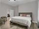 Serene bedroom with a plush bed, accent chairs, and calming neutral color scheme at 752 Sw Cooper St Sw, Atlanta, GA 30315