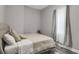 Cozy bedroom with grey walls, wood-look floors, and a big window at 752 Sw Cooper St Sw, Atlanta, GA 30315