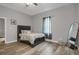 This bedroom boasts a modern style, wood-look floors, and natural light at 752 Sw Cooper St Sw, Atlanta, GA 30315