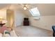 Finished attic featuring a skylight, recessed lighting, and ample space at 3750 Cannonwolde Dr, Snellville, GA 30039