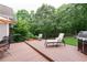 This home has a beautiful back deck overlooking a lush green yard with mature trees at 3750 Cannonwolde Dr, Snellville, GA 30039