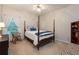 A bedroom features a four poster bed and a rocking chair at 3750 Cannonwolde Dr, Snellville, GA 30039