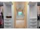 Walk-in closets leading to ensuite bathroom with tub and shower at 3750 Cannonwolde Dr, Snellville, GA 30039