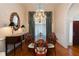Formal dining room showcasing hardwood floors, chandelier and custom curtains at 3750 Cannonwolde Dr, Snellville, GA 30039