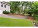 Driveway leading to a beautiful property with mature trees at 3750 Cannonwolde Dr, Snellville, GA 30039