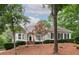 Charming home featuring manicured landscaping, bay windows and a welcoming front entry at 3750 Cannonwolde Dr, Snellville, GA 30039
