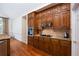 Well-equipped kitchen with wood cabinets, granite countertops, a tile backsplash, and stainless appliances at 3750 Cannonwolde Dr, Snellville, GA 30039