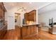 Open kitchen with wood island, stainless steel appliances, and hardwood floors at 3750 Cannonwolde Dr, Snellville, GA 30039