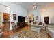 Cozy living room featuring hardwood floors, a ceiling fan, and traditional-style furniture at 3750 Cannonwolde Dr, Snellville, GA 30039