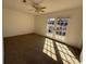 Sunlit bedroom featuring carpet, ceiling fan, and access to the backyard at 4485 Golf Vista Cir, Decatur, GA 30035
