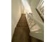 Carpeted staircase with white rails in a home with lots of natural light at 4485 Golf Vista Cir, Decatur, GA 30035