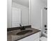 Bathroom features vanity with granite counters, modern fixtures, and a shower with glass door at 6175 Beaver Crossing Dr, Cumming, GA 30040