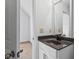 Bathroom featuring a granite countertop and neutral cabinet at 6175 Beaver Crossing Dr, Cumming, GA 30040