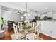 Cozy dining area adjacent to living room and kitchen with hardwood floors at 6175 Beaver Crossing Dr, Cumming, GA 30040