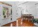 Formal dining room with hardwood floors, white trim, and chandelier at 6175 Beaver Crossing Dr, Cumming, GA 30040