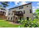 Two story exterior shows a deck, patio, and backyard at 6175 Beaver Crossing Dr, Cumming, GA 30040