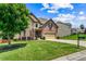 Charming two-story brick home with a well-manicured lawn and inviting curb appeal at 6175 Beaver Crossing Dr, Cumming, GA 30040