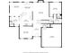 First floor plan showcasing kitchen, dining room, living room, bedroom, bathroom, and garage at 6175 Beaver Crossing Dr, Cumming, GA 30040