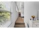 Upstairs hallway showcasing a window with natural light and a closet at 6175 Beaver Crossing Dr, Cumming, GA 30040