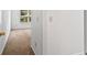 View of carpeted hallway from bedroom with white walls and trim at 6175 Beaver Crossing Dr, Cumming, GA 30040