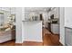 Well-appointed kitchen with granite countertops, stainless appliances, and wood floors at 6175 Beaver Crossing Dr, Cumming, GA 30040