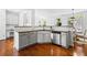 Bright kitchen features white cabinetry, granite countertops, and stainless steel appliances at 6175 Beaver Crossing Dr, Cumming, GA 30040