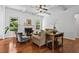 Bright living room showcasing a coffered ceiling, fireplace, and ample natural light at 6175 Beaver Crossing Dr, Cumming, GA 30040